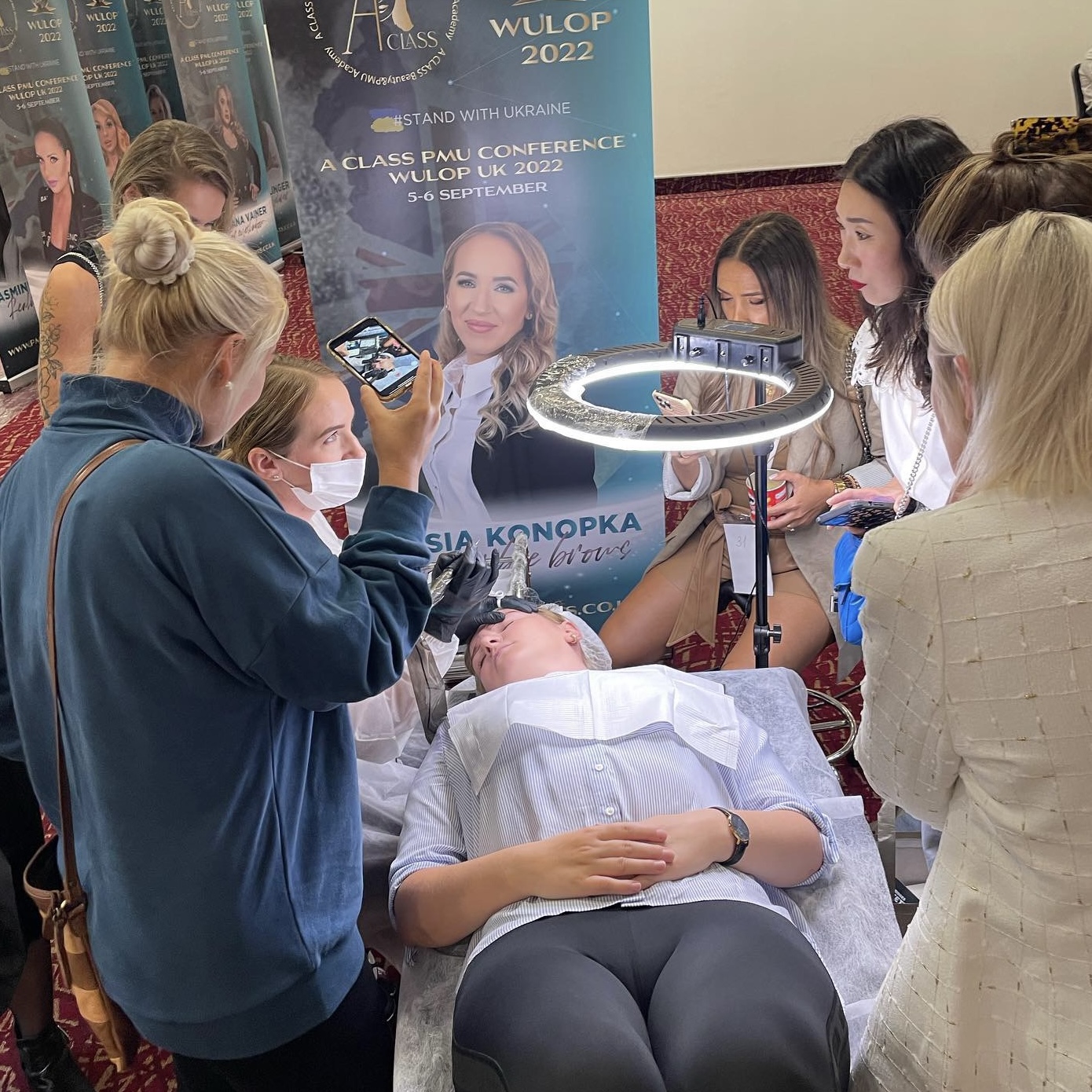 osia Konopka as a Soft Ombre Brows demonstrator and speaker at WULOP UK 2022, performing a live permanent makeup demonstration.